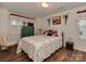 Cozy bedroom with unique bicycle decor, wood-look flooring, and natural light at 3020 Graceland Cir # 11D, Pineville, NC 28134