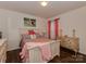 Bright bedroom with a cozy bed, vintage dresser, and stylish decor at 3020 Graceland Cir # 11D, Pineville, NC 28134