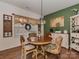 Cozy dining room featuring a round wooden table, decorative accents, and ample natural light at 3020 Graceland Cir # 11D, Pineville, NC 28134