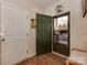 Bright foyer with hardwood floors, a decorative bench, and an inviting entrance at 3020 Graceland Cir # 11D, Pineville, NC 28134