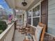 Relaxing front porch with rocking chairs and charming decor, perfect for enjoying the outdoors at 3020 Graceland Cir # 11D, Pineville, NC 28134