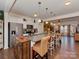 Spacious kitchen featuring a large island, granite countertops, and stainless steel appliances at 3020 Graceland Cir # 11D, Pineville, NC 28134