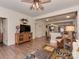Open-concept living room showcasing hardwood floors, modern decor, and seamless flow into the kitchen area at 3020 Graceland Cir # 11D, Pineville, NC 28134