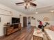 Spacious living room with hardwood floors, ceiling fan, TV and exercise bike at 3020 Graceland Cir # 11D, Pineville, NC 28134