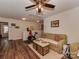 Cozy living room with ceiling fan, decorative storage trunks, and comfortable seating at 3020 Graceland Cir # 11D, Pineville, NC 28134