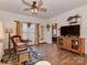 Bright living room featuring hardwood floors, large windows, and a comfortable seating area with a decorative rug at 3020 Graceland Cir # 11D, Pineville, NC 28134