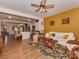 Inviting living room featuring hardwood floors, a ceiling fan, and a comfortable sofa with decorative pillows at 3020 Graceland Cir # 11D, Pineville, NC 28134
