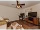 Open living room featuring hardwood floors, TV, computer desk, and lots of seating at 3020 Graceland Cir # 11D, Pineville, NC 28134
