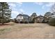 Rear view of house showcasing brick exterior and landscaping at 3408 Out Of Bounds Dr, Monroe, NC 28112