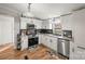 Modern white kitchen with stainless steel appliances at 3510 Oakwood Ave, Claremont, NC 28610