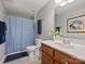 Traditional bathroom with wooden vanity and shower-tub combination at 3827 Bramwyck Dr, Charlotte, NC 28210
