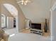 Cozy bedroom setup with a vaulted ceiling, modern furniture, and natural light at 3827 Bramwyck Dr, Charlotte, NC 28210
