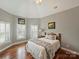 Charming bedroom with wood floors, vaulted ceilings, and a light color scheme at 3827 Bramwyck Dr, Charlotte, NC 28210