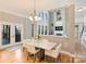 Dining room with chandelier lighting, hardwood floors and view of living room at 3827 Bramwyck Dr, Charlotte, NC 28210