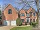 Charming brick two-story home with manicured lawn and two car garage at 3827 Bramwyck Dr, Charlotte, NC 28210