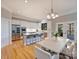 Modern kitchen featuring stainless steel appliances, island seating, and hardwood floors at 3827 Bramwyck Dr, Charlotte, NC 28210