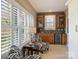 Inviting sitting room with custom cabinets, a beverage fridge, and a scenic window view at 3827 Bramwyck Dr, Charlotte, NC 28210