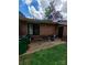 Brick patio with lawn, trash can, and grill at 4818 Highlake Dr, Charlotte, NC 28215