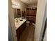 Bathroom with shower/tub combo and wood-look flooring at 4818 Highlake Dr, Charlotte, NC 28215