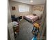 Bedroom with a bed, side table, and carpet flooring at 4818 Highlake Dr, Charlotte, NC 28215