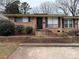 Charming brick ranch home with a front entrance and steps at 4818 Highlake Dr, Charlotte, NC 28215