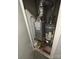 Mechanical room with water heater and HVAC unit at 4818 Highlake Dr, Charlotte, NC 28215