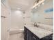 Bathroom with a white subway tile shower and a dark vanity with marble top at 502 E 2Nd St, Salisbury, NC 28146