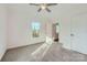 Bright bedroom with carpet flooring, large window, and ample natural light at 502 E 2Nd St, Salisbury, NC 28146