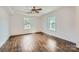 Spacious bedroom with hardwood floors and two windows at 502 E 2Nd St, Salisbury, NC 28146