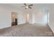 Spacious bedroom with neutral carpet, ceiling fan, and ample closet space at 502 E 2Nd St, Salisbury, NC 28146