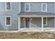 House exterior, featuring a front porch with white columns and a gray door at 502 E 2Nd St, Salisbury, NC 28146