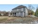 Rear view of a two-story gray house with a small deck at 502 E 2Nd St, Salisbury, NC 28146