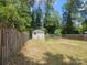 Large backyard with storage shed and wooden fence at 5024 Victoria Ave, Charlotte, NC 28269