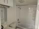 Updated bathroom with tub, toilet, and vanity at 5024 Victoria Ave, Charlotte, NC 28269