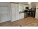 Modern kitchen with stainless steel appliances and white cabinets at 5024 Victoria Ave, Charlotte, NC 28269