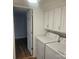 Laundry room with washer, dryer, and cabinets at 5024 Victoria Ave, Charlotte, NC 28269