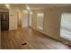 Bright living area with light walls and wood-look floors at 5024 Victoria Ave, Charlotte, NC 28269