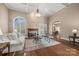 Inviting living room with coffered ceilings, a fireplace, and comfortable seating at 557 Medora Ln, Fort Mill, SC 29708