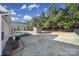 Backyard view showcasing storage shed and wooded area at 5803 Mcclintock Dr, Denver, NC 28037