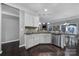 Modern kitchen with white cabinets, granite countertops, and stainless steel appliances at 5803 Mcclintock Dr, Denver, NC 28037