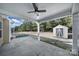 Covered patio with ceiling fan, storage shed, and fenced backyard at 5803 Mcclintock Dr, Denver, NC 28037