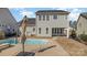 Stunning backyard featuring a refreshing pool and outdoor dining space at 630 Daventry Ct, Clover, SC 29710