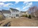 Spacious backyard with a private pool, lounging area, and lush green landscaping at 630 Daventry Ct, Clover, SC 29710