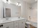 Bright bathroom featuring double sink vanity, large mirror and a bathtub with white tiling at 630 Daventry Ct, Clover, SC 29710