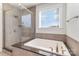 Modern bathroom with large soaking tub and seamless glass shower enclosure at 630 Daventry Ct, Clover, SC 29710