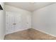 Carpeted bedroom with a double-door closet and an additional single-door closet at 630 Daventry Ct, Clover, SC 29710