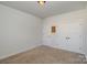 Neutral bedroom with carpet flooring and a double-door closet, providing ample storage space at 630 Daventry Ct, Clover, SC 29710