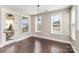 Bright dining area features hardwood floors, neutral paint, and views of the pool area and outdoor patio at 630 Daventry Ct, Clover, SC 29710