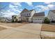 Attractive two-story home with a spacious driveway leading to an attached two-car garage at 630 Daventry Ct, Clover, SC 29710