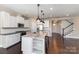 Well-appointed kitchen with a center island, stainless steel appliances, and white cabinetry at 630 Daventry Ct, Clover, SC 29710